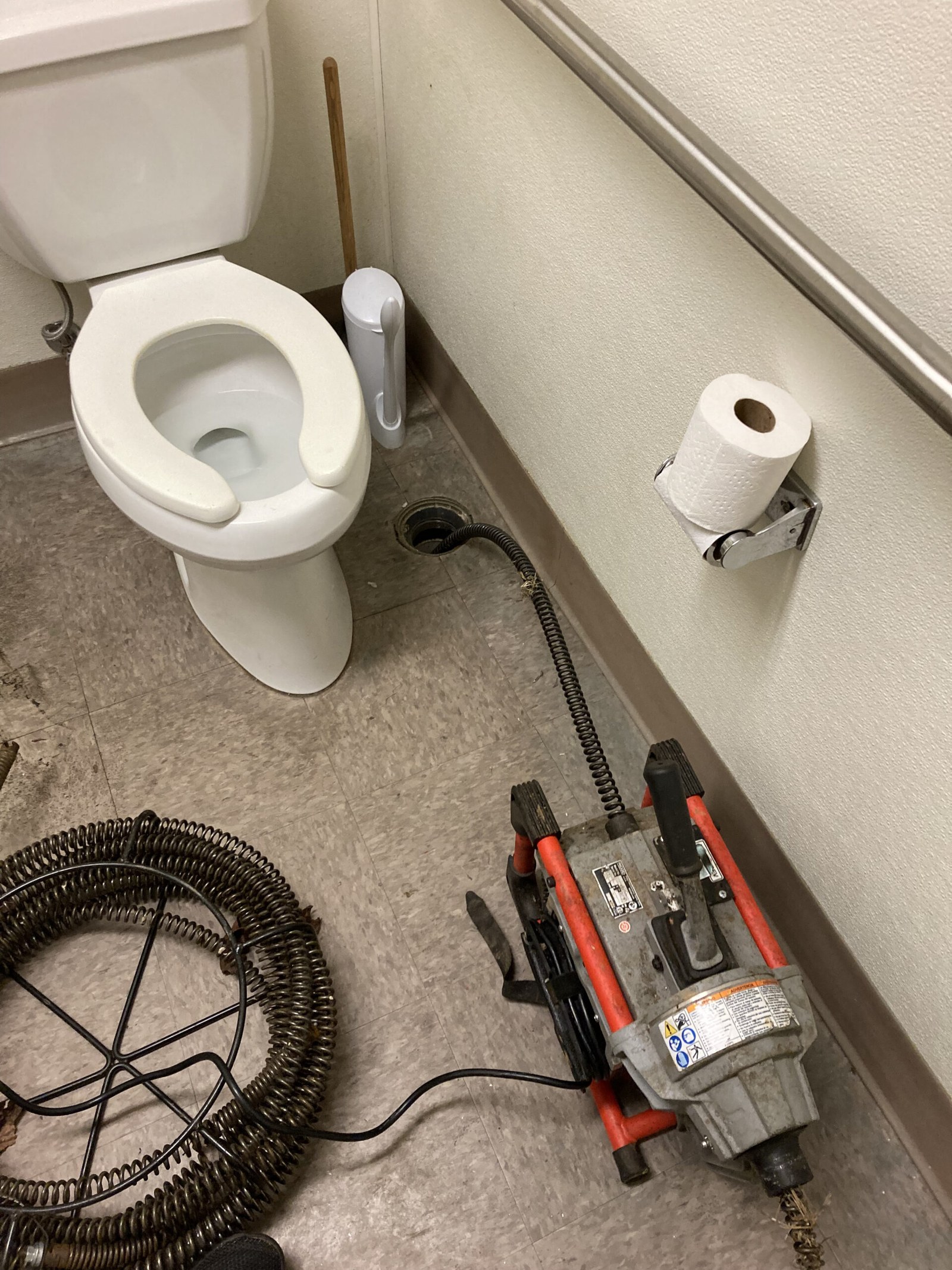 Toilet pulled and drain equipment staged for an urgent repair