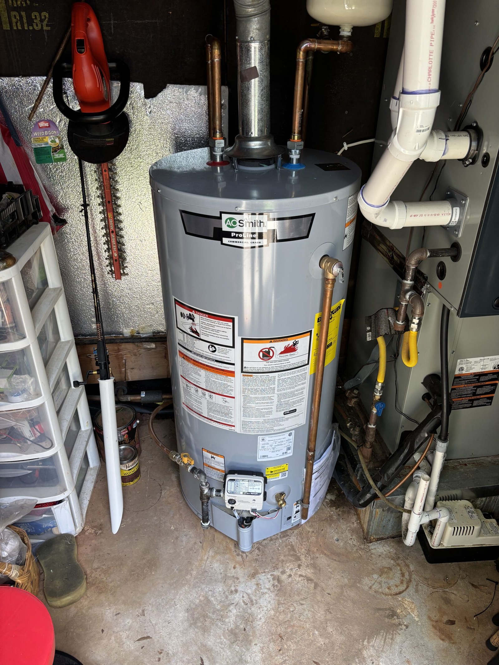 Water heater piped and ready in a utility closet